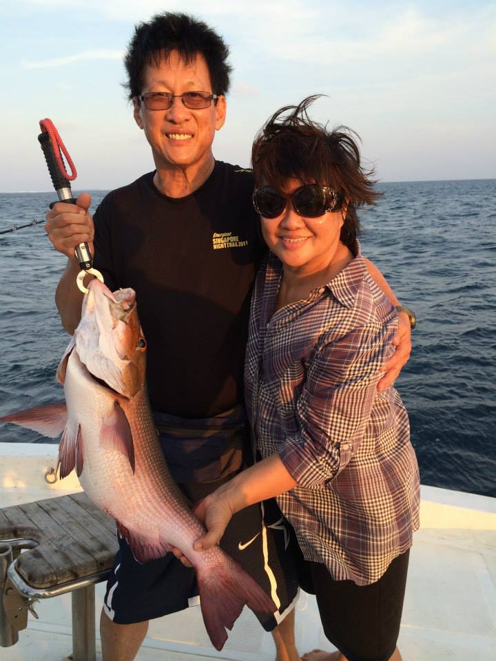 Raymond and Sally fishing in the Maldives during a holiday trip. 