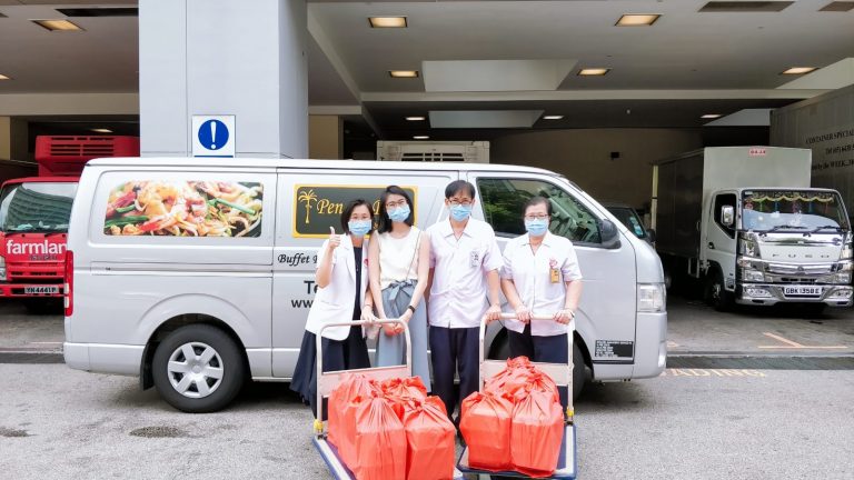 Despite "bleeding money" since February, Penang Place is still committed to preparing food and delivering them to healthcare workers for free. Pictured here are staff members from the National Centre for Infectious Diseases collecting their lunch. Photo courtesy of Paul Ooi.